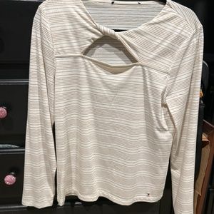 Woman’s gold and white shirt